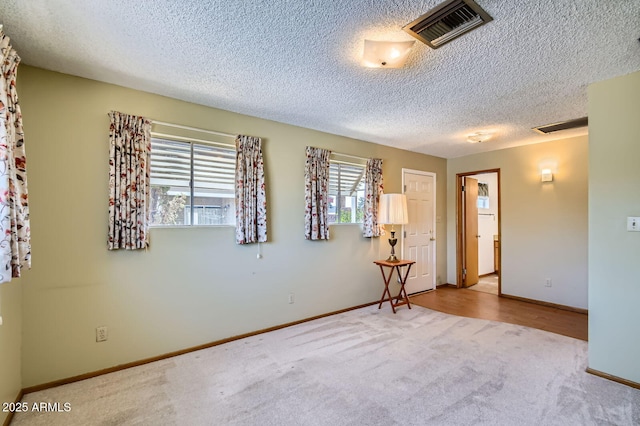 3944 E Oak St, Phoenix, AZ 85008 - carpeted spare room featuring a textured ceiling