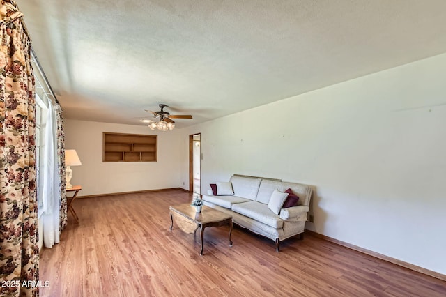 3944 E Oak St, Phoenix, AZ 85008 - living area featuring light wood finished floors and ceiling fan