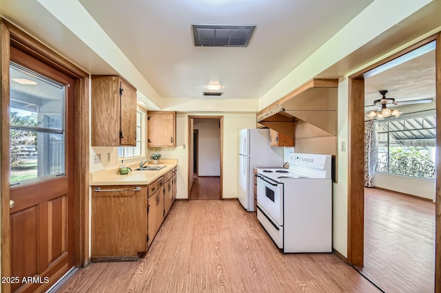 3944 E Oak St, Phoenix, AZ 85008 - kitchen with white appliances, light countertops, light wood-style flooring, ceiling fan, and healthy amount of natural light