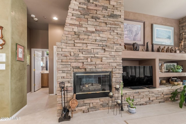 tiled living room featuring a fireplace