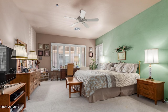 bedroom featuring light carpet and ceiling fan