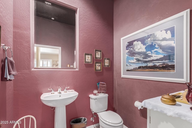 bathroom with sink and toilet