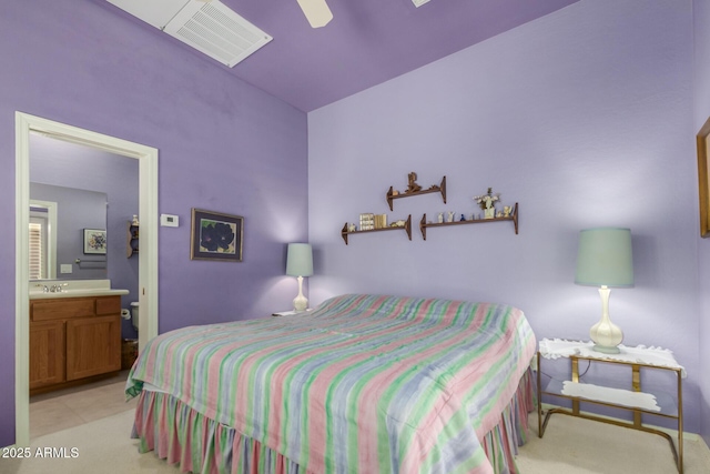 bedroom featuring ceiling fan and ensuite bath