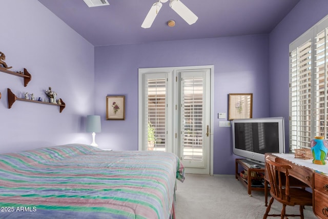 carpeted bedroom featuring ceiling fan and access to exterior