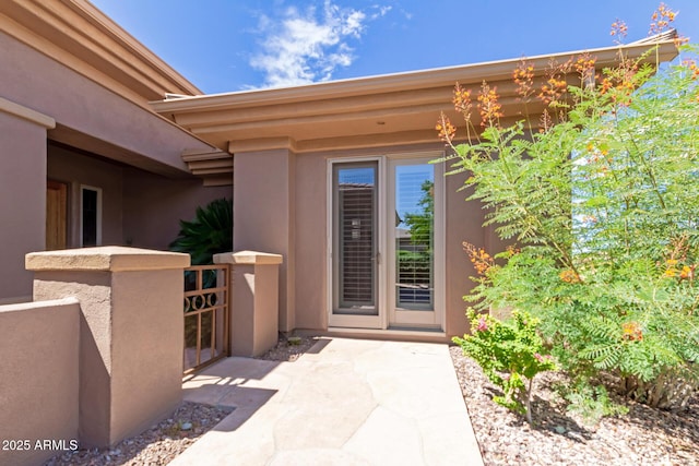 property entrance featuring a patio