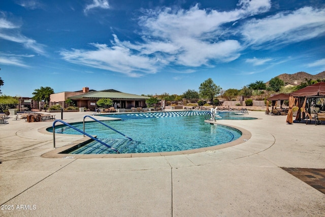 view of pool featuring a patio area