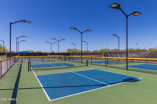 view of sport court featuring basketball hoop