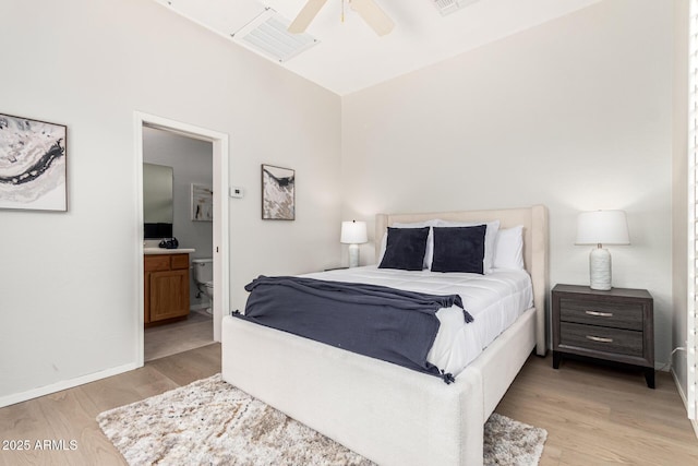 bedroom featuring connected bathroom, baseboards, visible vents, and light wood-type flooring