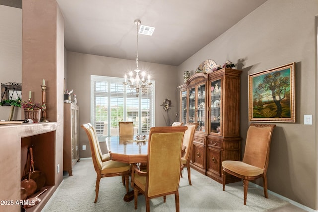 carpeted dining space with a notable chandelier