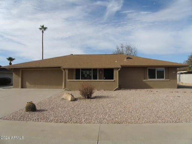 ranch-style home with a garage