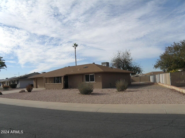 single story home featuring a garage