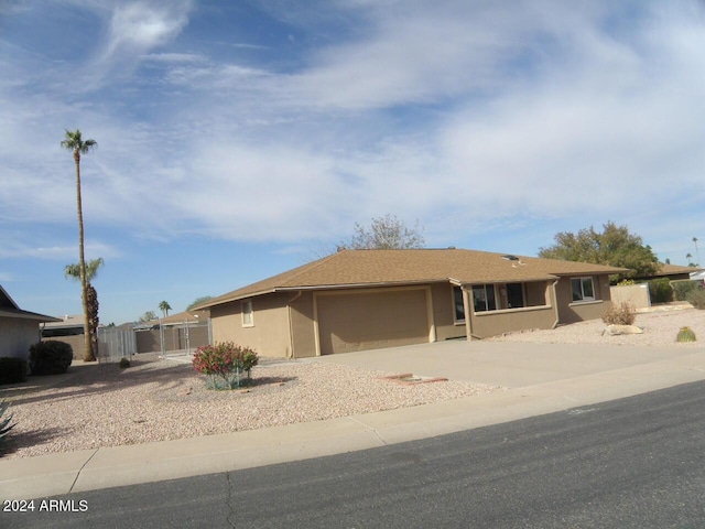 ranch-style home featuring a garage