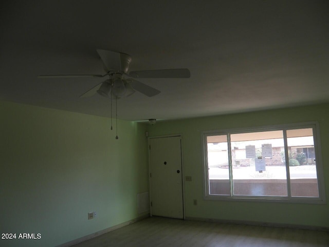 unfurnished room featuring ceiling fan and light hardwood / wood-style flooring