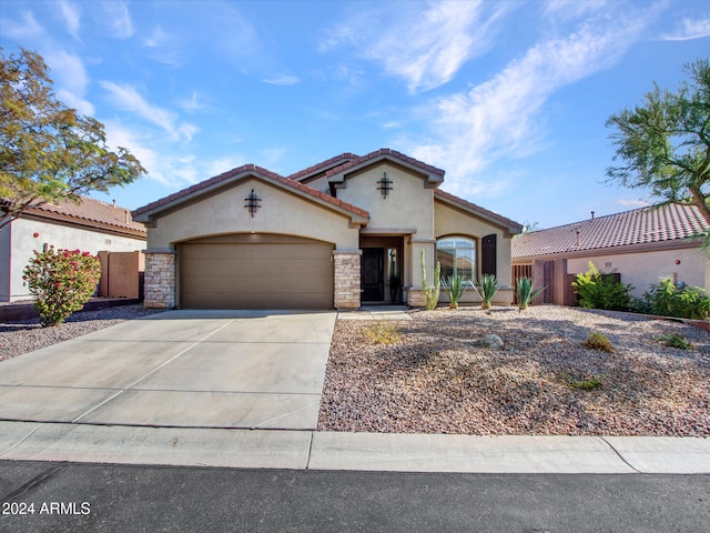 mediterranean / spanish-style house featuring a garage