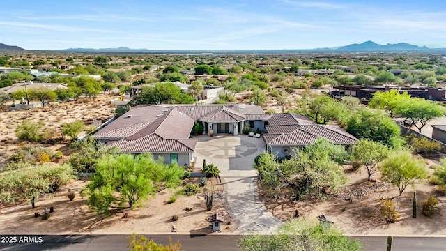 drone / aerial view featuring a mountain view