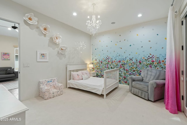 carpeted bedroom featuring an inviting chandelier