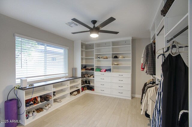 5441 E Wethersfield Rd, Scottsdale, AZ 85254 - spacious closet featuring a ceiling fan and light wood-type flooring