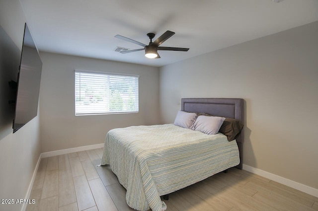 5441 E Wethersfield Rd, Scottsdale, AZ 85254 - bedroom with light wood-style flooring, baseboards, and a ceiling fan