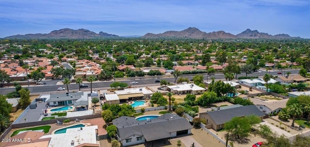 5441 E Wethersfield Rd, Scottsdale, AZ 85254 - aerial view of residential area with a pool area and a mountainous background