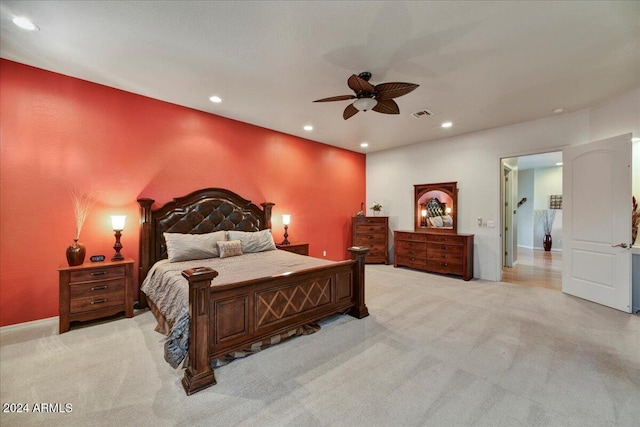 bedroom featuring ceiling fan and light carpet