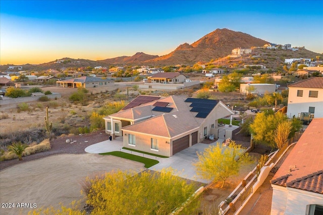 aerial view at dusk with a mountain view