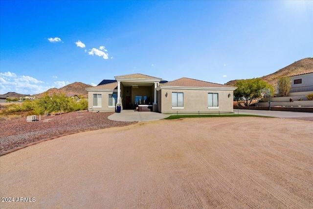 view of front of house featuring a mountain view