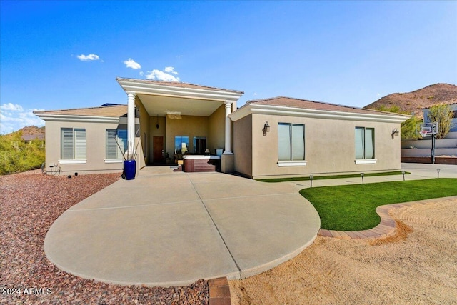 back of property with a patio area