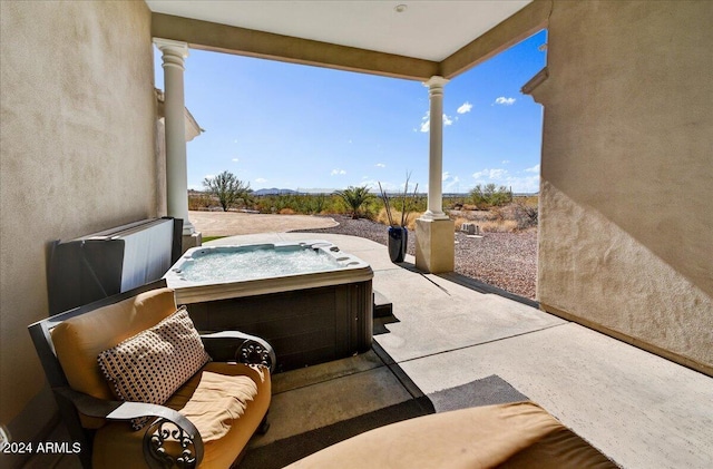 view of patio / terrace featuring a hot tub