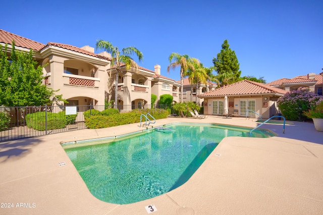 view of swimming pool featuring a patio