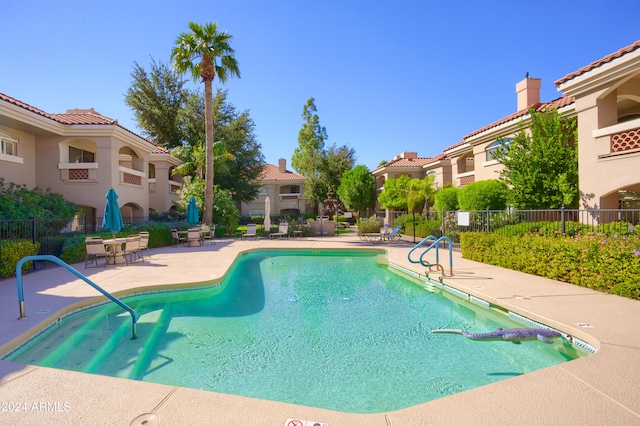 view of swimming pool featuring a patio