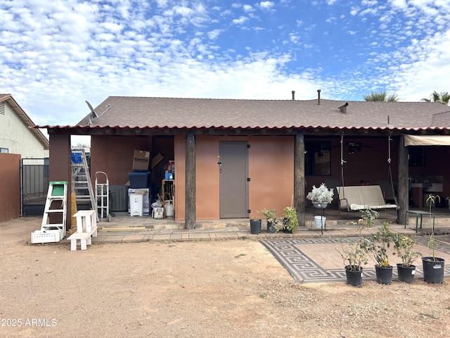 rear view of house with a patio