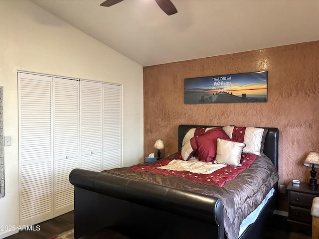 bedroom featuring ceiling fan, a closet, and lofted ceiling