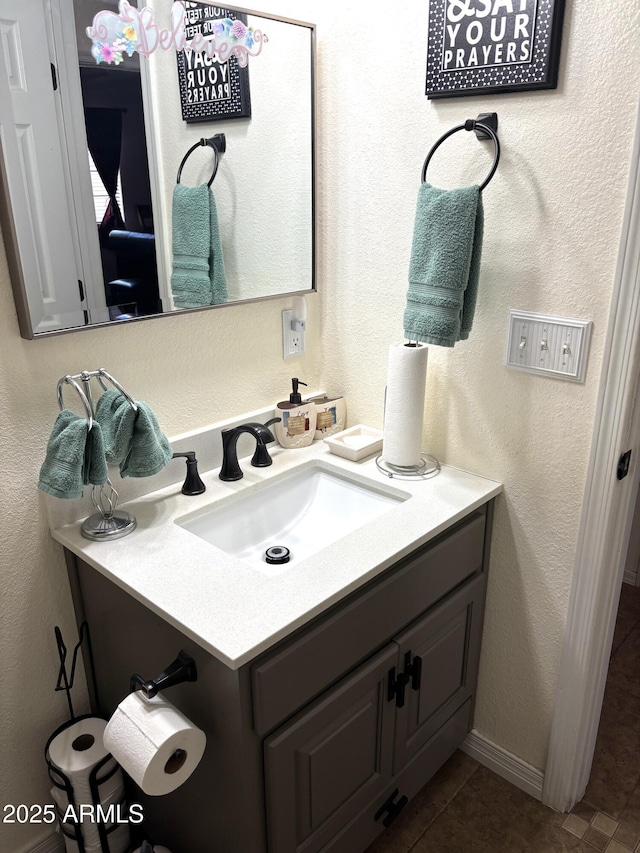 bathroom with tile patterned floors and vanity