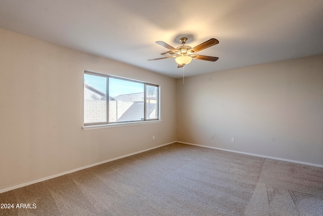 carpeted empty room with ceiling fan