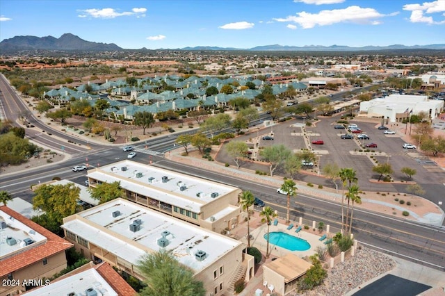 birds eye view of property with a mountain view