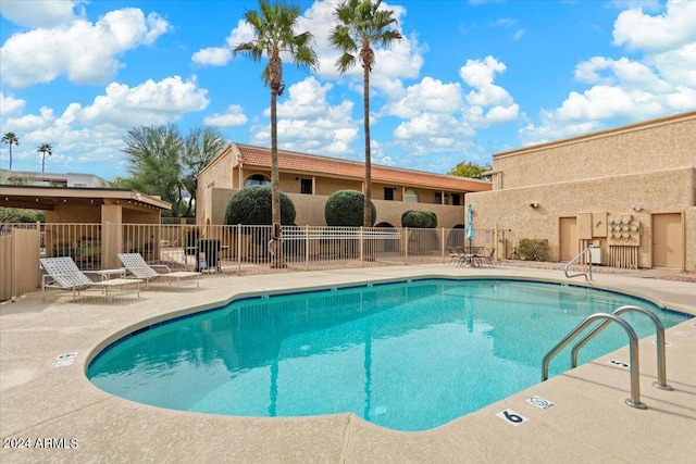 view of swimming pool featuring a patio