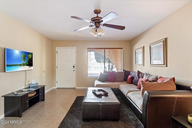 tiled living room with ceiling fan