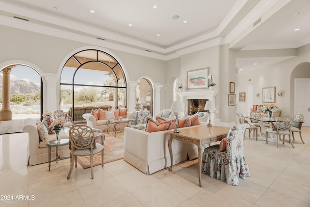 tiled living room featuring a raised ceiling and ornamental molding