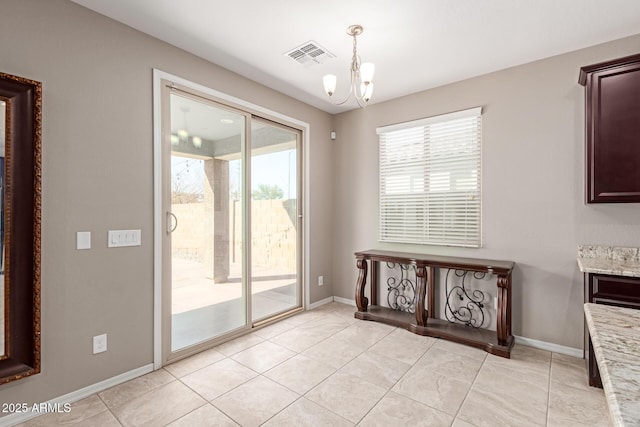 dining space with an inviting chandelier, light tile patterned floors, visible vents, and baseboards