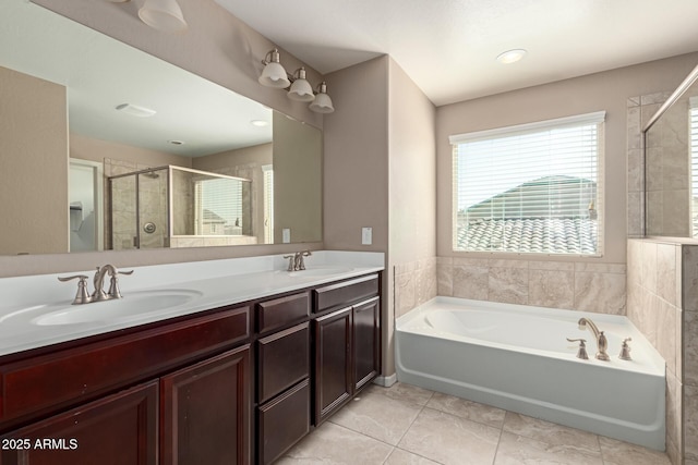 full bath with double vanity, a shower stall, a bath, and a sink