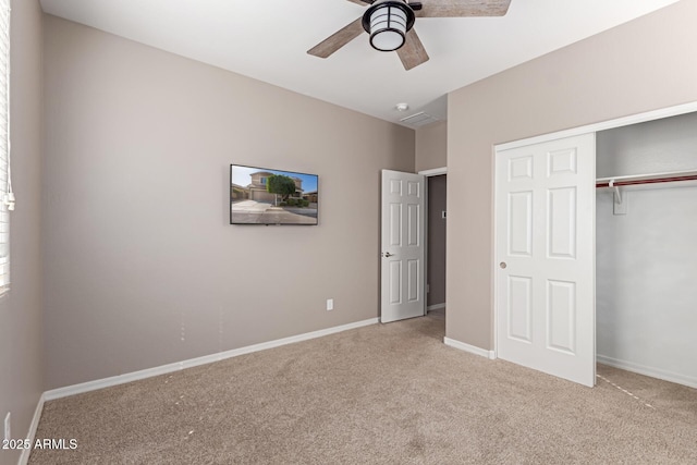 unfurnished bedroom featuring ceiling fan, a closet, baseboards, and carpet floors