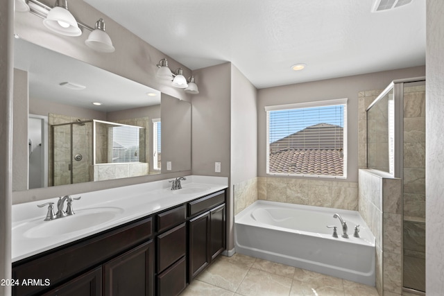 bathroom featuring vanity, plus walk in shower, and tile patterned floors