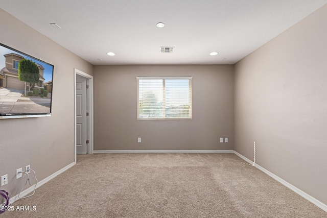 carpeted spare room with visible vents, recessed lighting, and baseboards