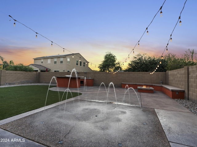exterior space with a swimming pool and a fenced backyard