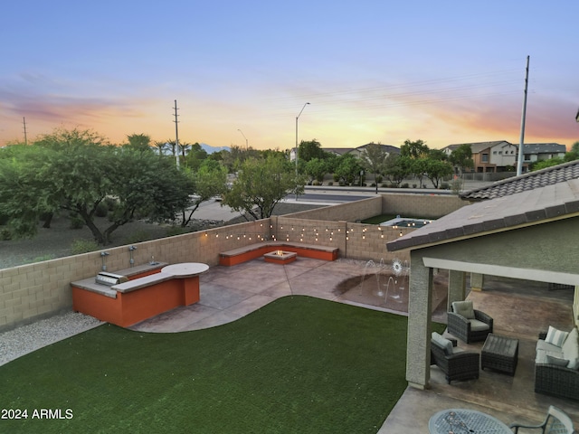 view of yard featuring an outdoor hangout area, area for grilling, a fenced backyard, and a patio area