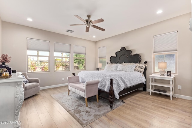 bedroom with ceiling fan and light wood-type flooring