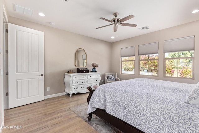 bedroom featuring light wood-type flooring and ceiling fan