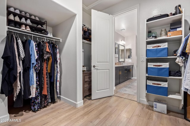 walk in closet featuring light wood-type flooring