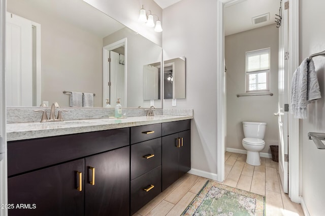 bathroom with vanity and toilet