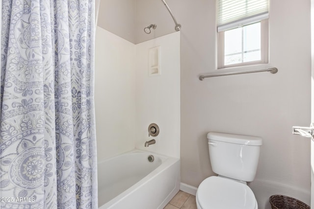 bathroom featuring shower / bathtub combination with curtain, toilet, and tile patterned flooring